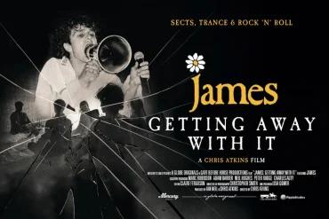 Poster for the film James: Getting Away With It, showing a male singer with a microphone and a cracked-glass motif, with the title in bold white lettering and a daisy graphic above 'James'.